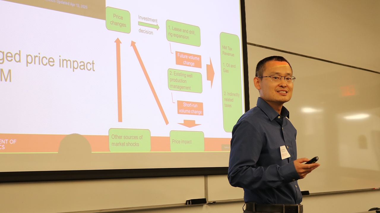 Dr. Xiaoyang Wang presents his research project: The Impact of Energy Price Changes on New Mexico State Revenue